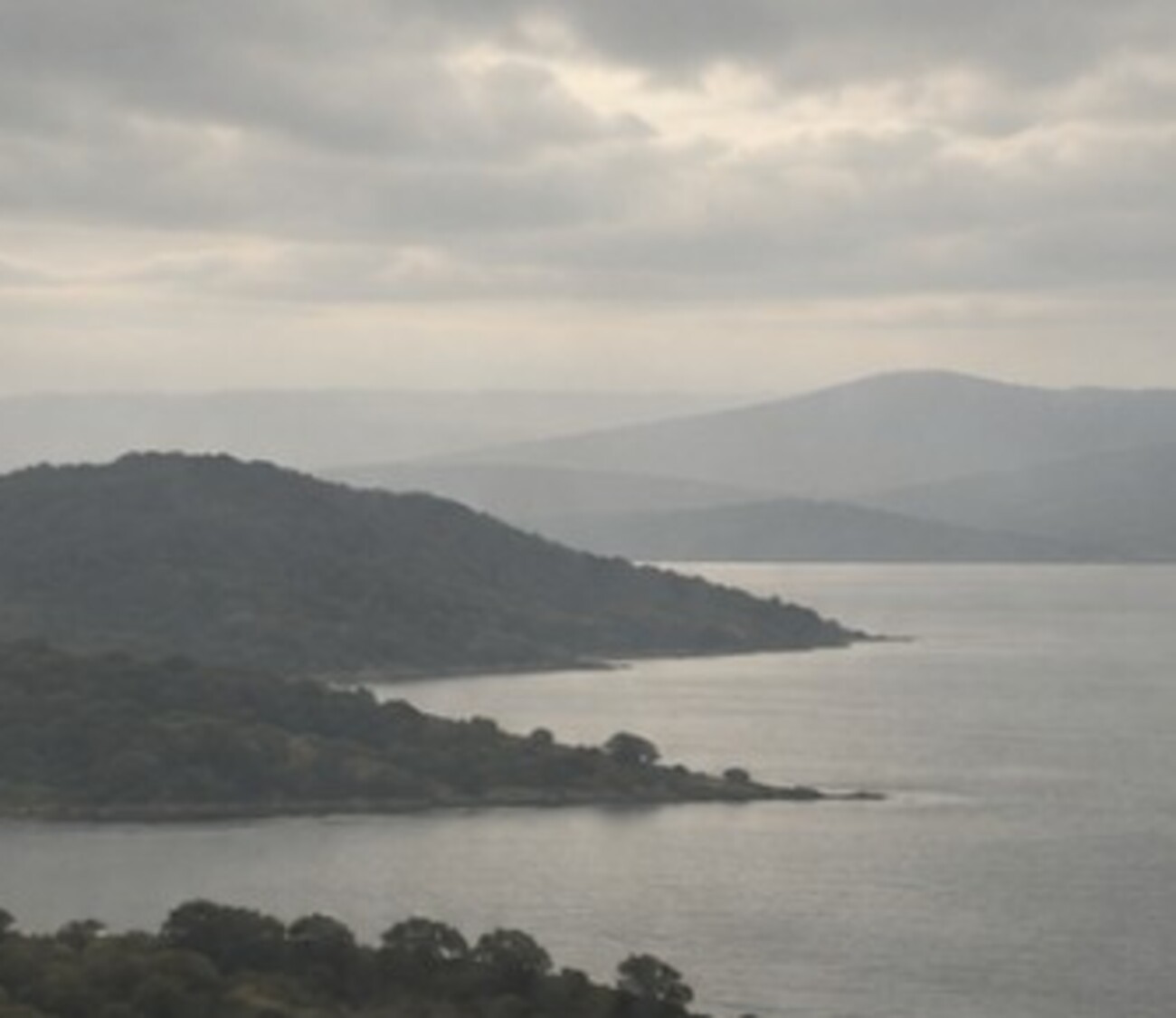 A quiet lake and distant landscape